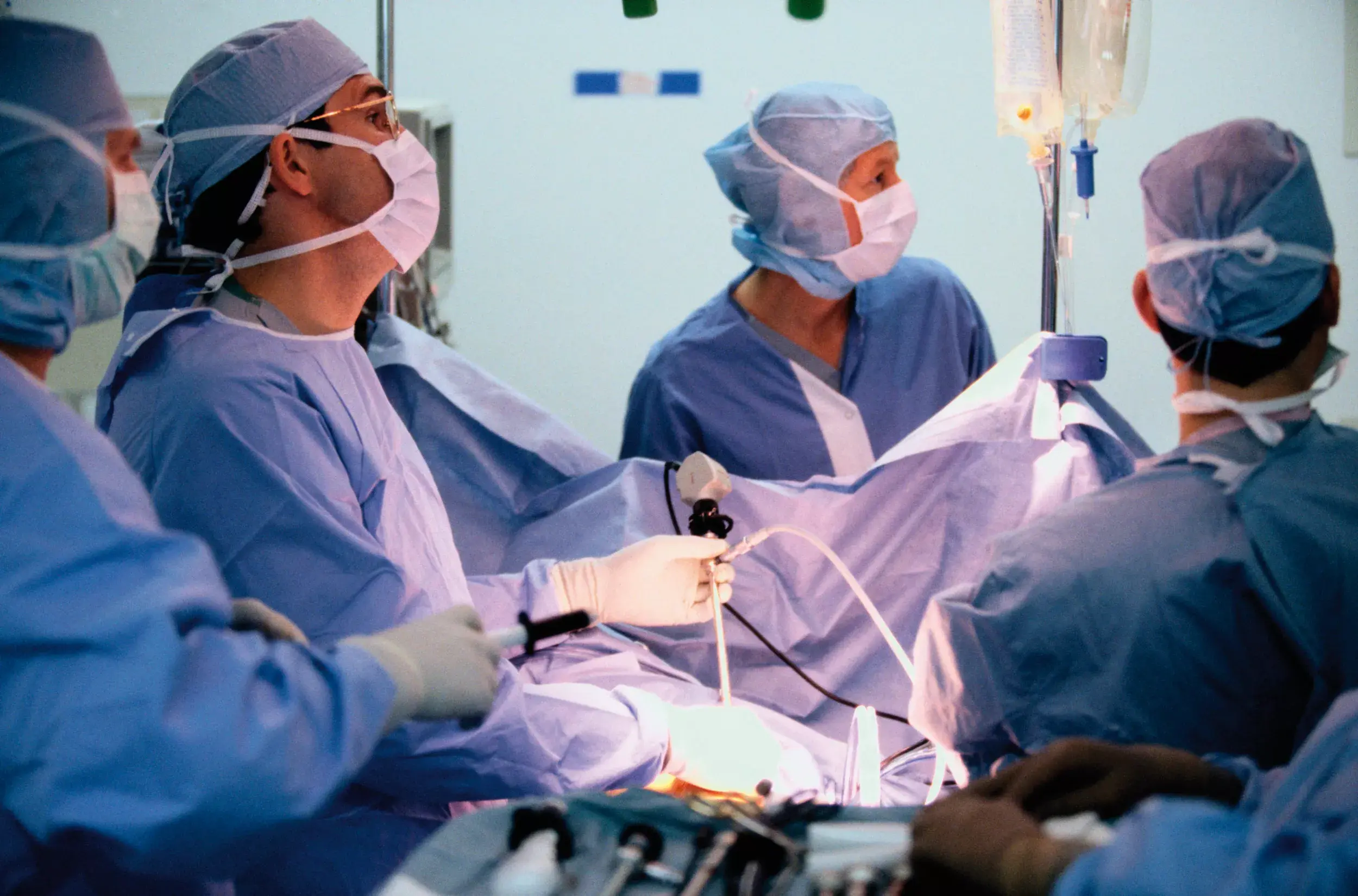 Surgeons operating on a patient