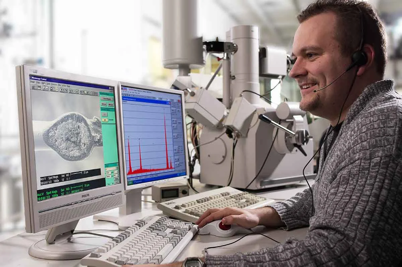 A man at a computer in lab