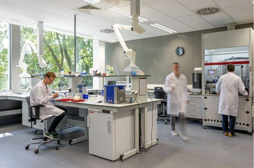 Three people in a lab