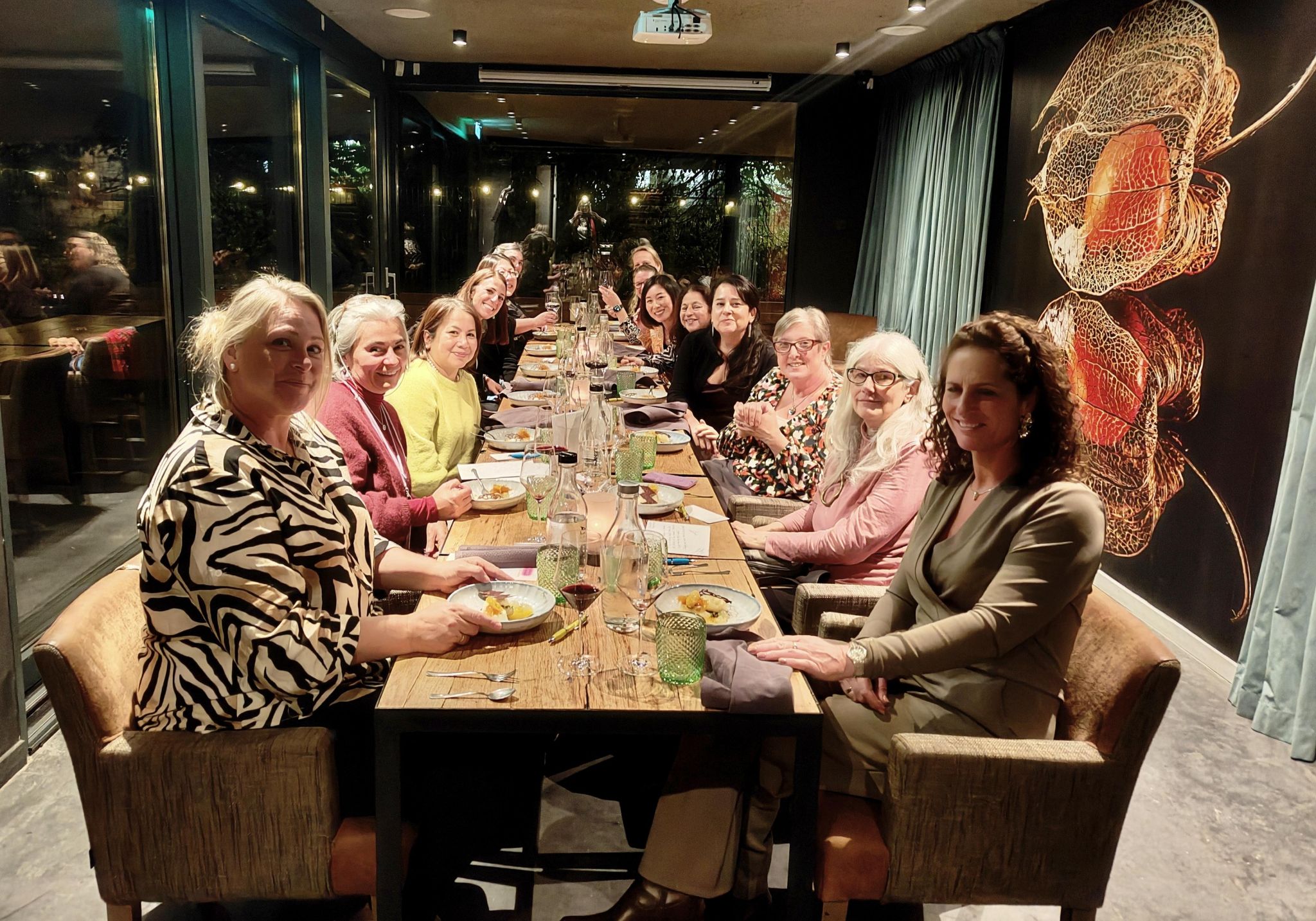 Women sitting at long dinner table