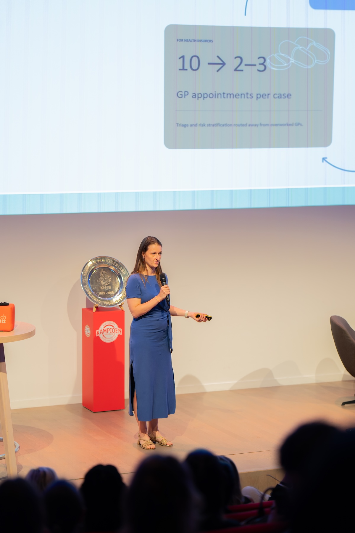 Woman presenting on stage