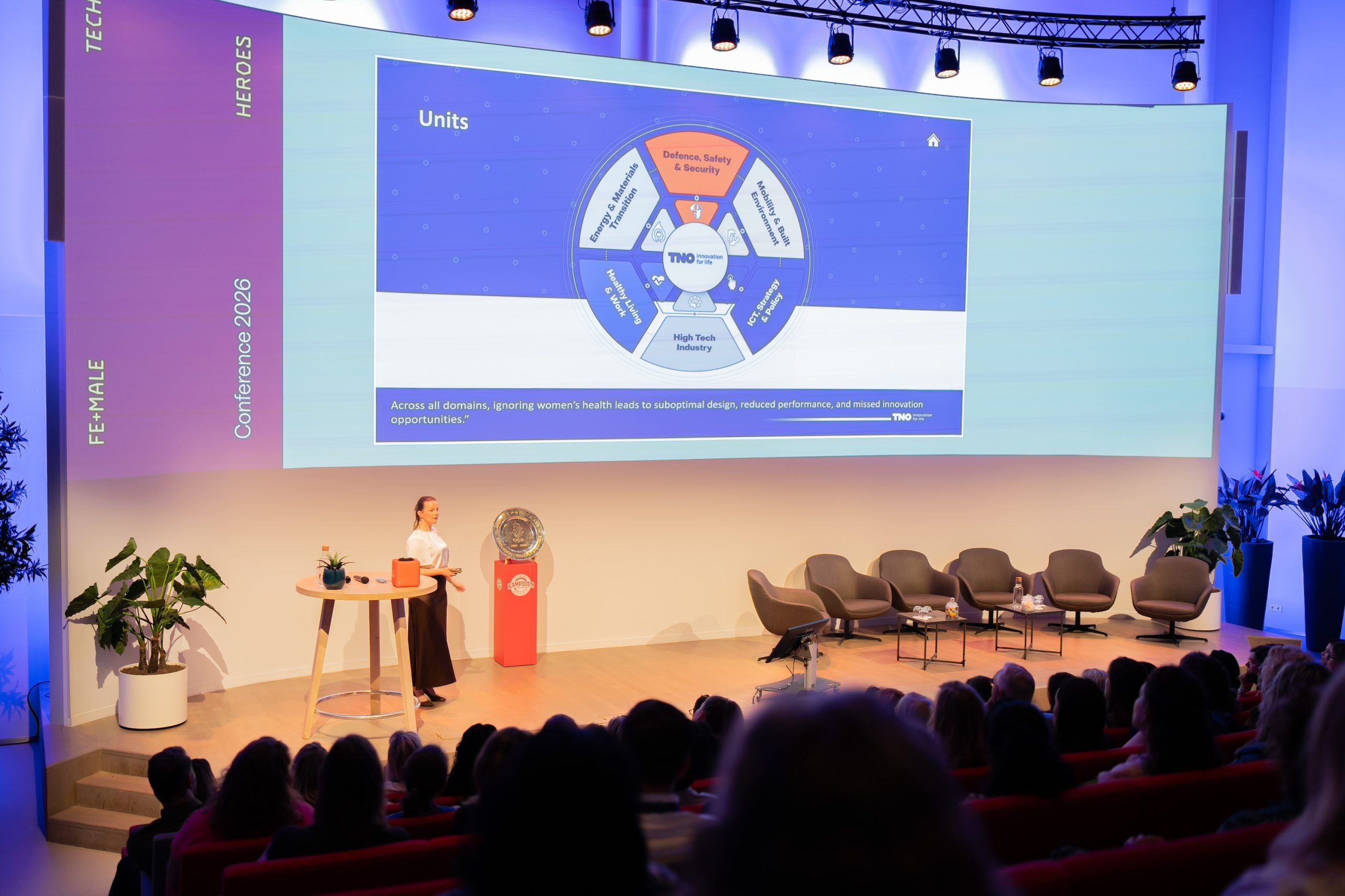 Woman on stage with data charg