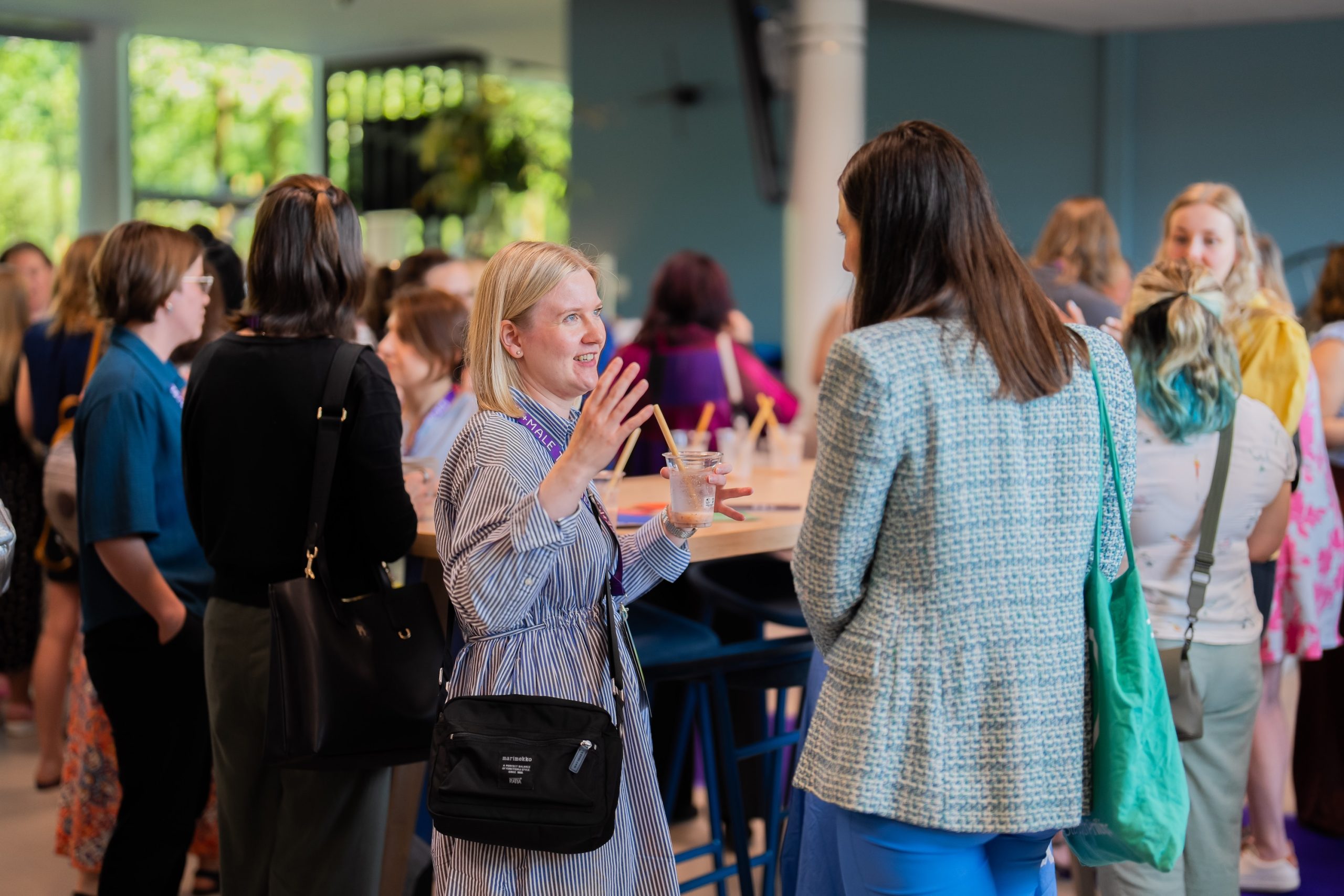 Women networking in a crowd