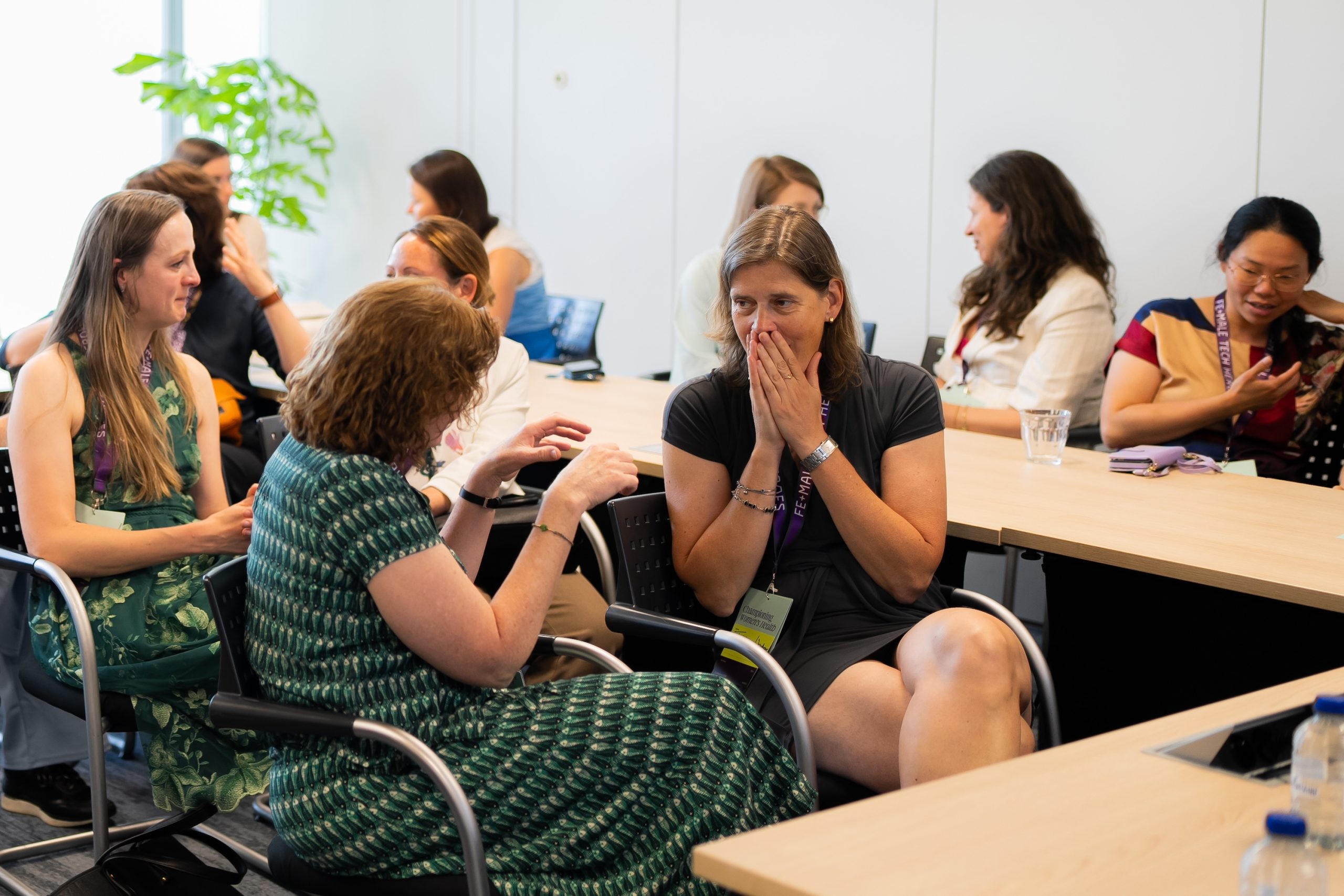 Women talking intently in workshop