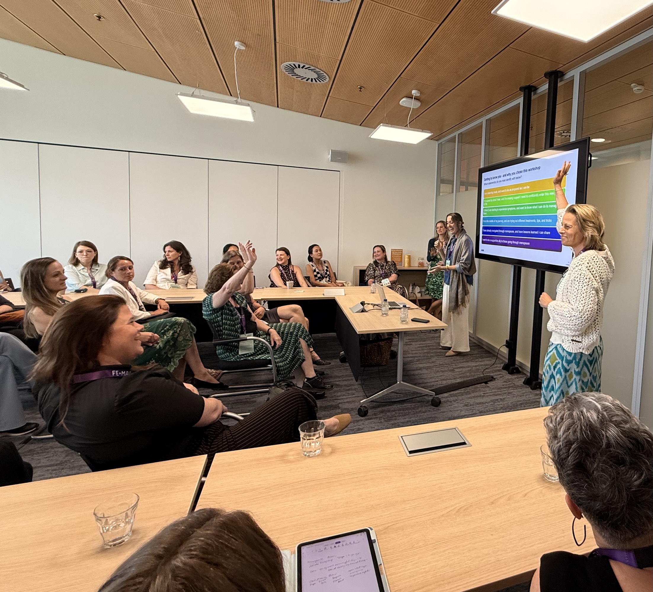 Woman raising her hand during a workshop